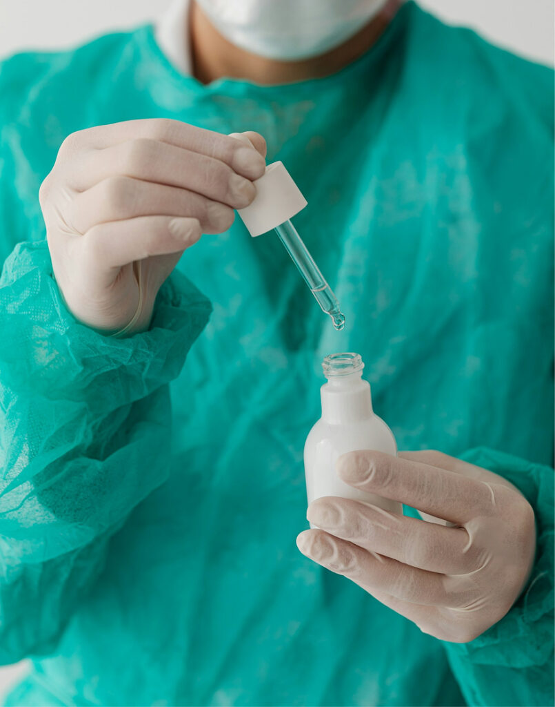 Medical professional with dropper