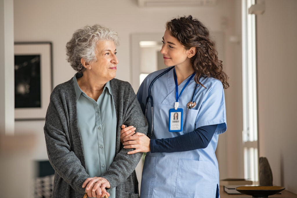 Healthcare professionals supporting a patient throughout their care journey
